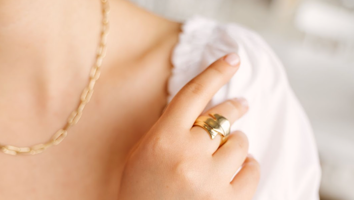 Model Wearing Gold Rings and Necklace