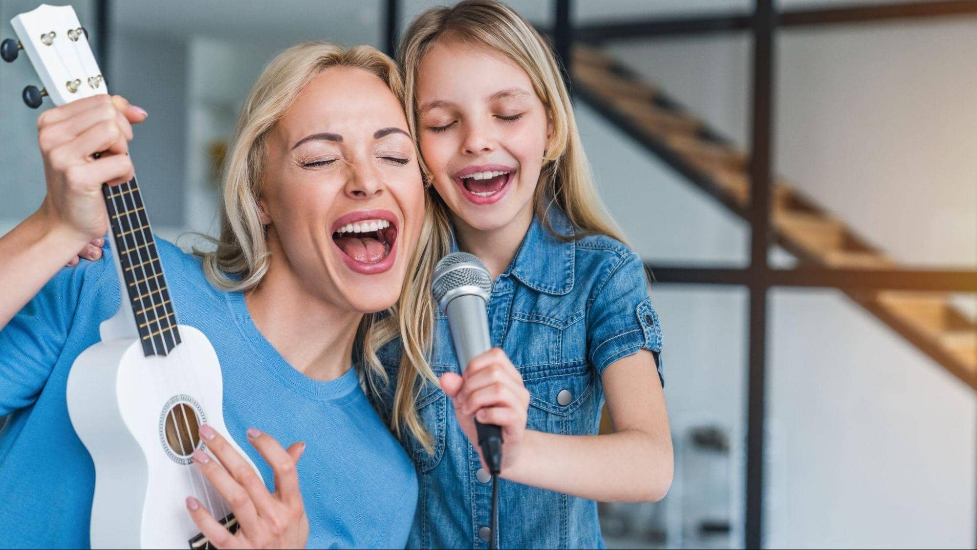 Mother and Daughter Singing and Playing Guitar