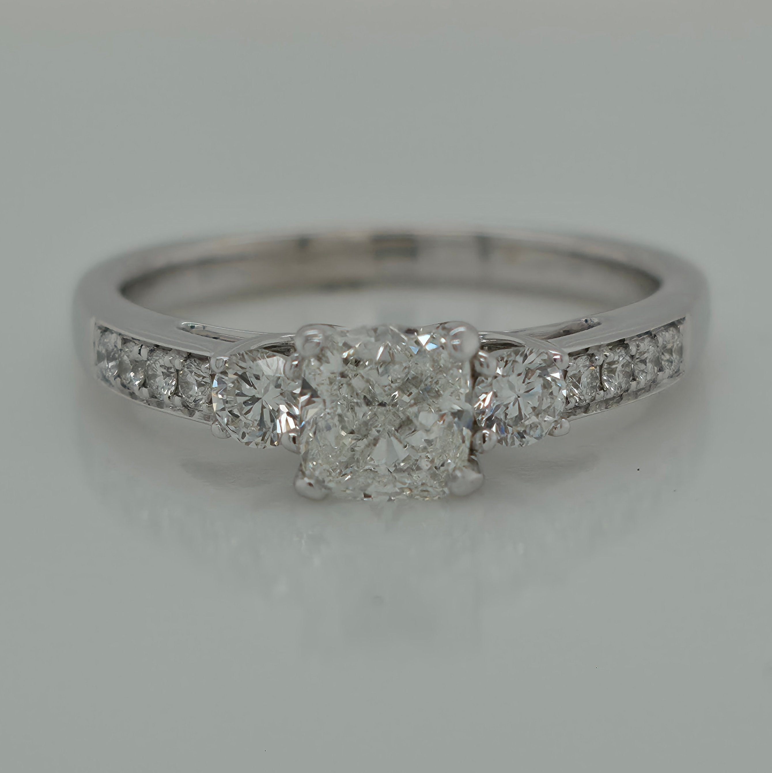 0.85ct Cushion Shaped Three Stone Diamond Engagement Ring