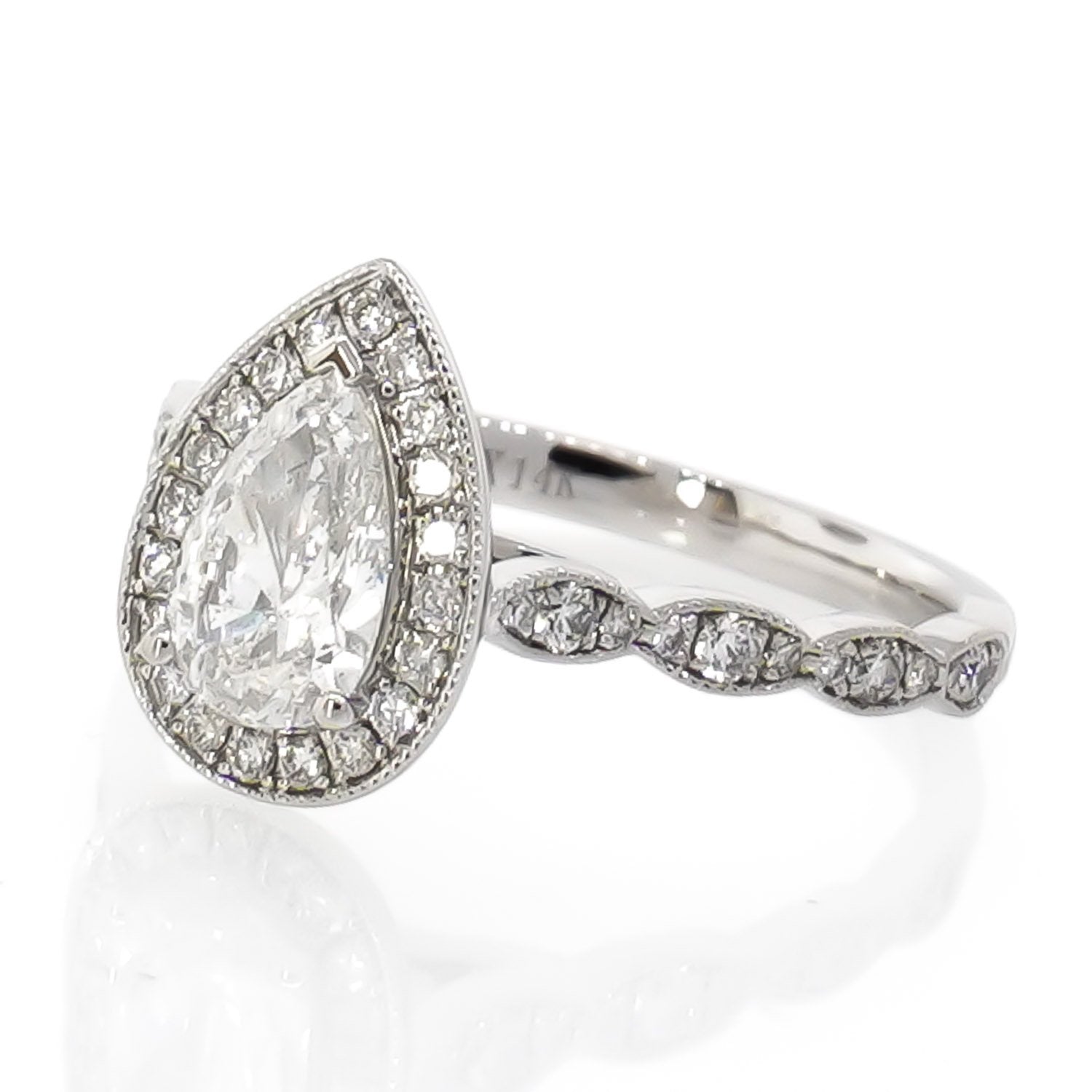 0.67ct Pear Shaped Diamond Halo Engagement Ring